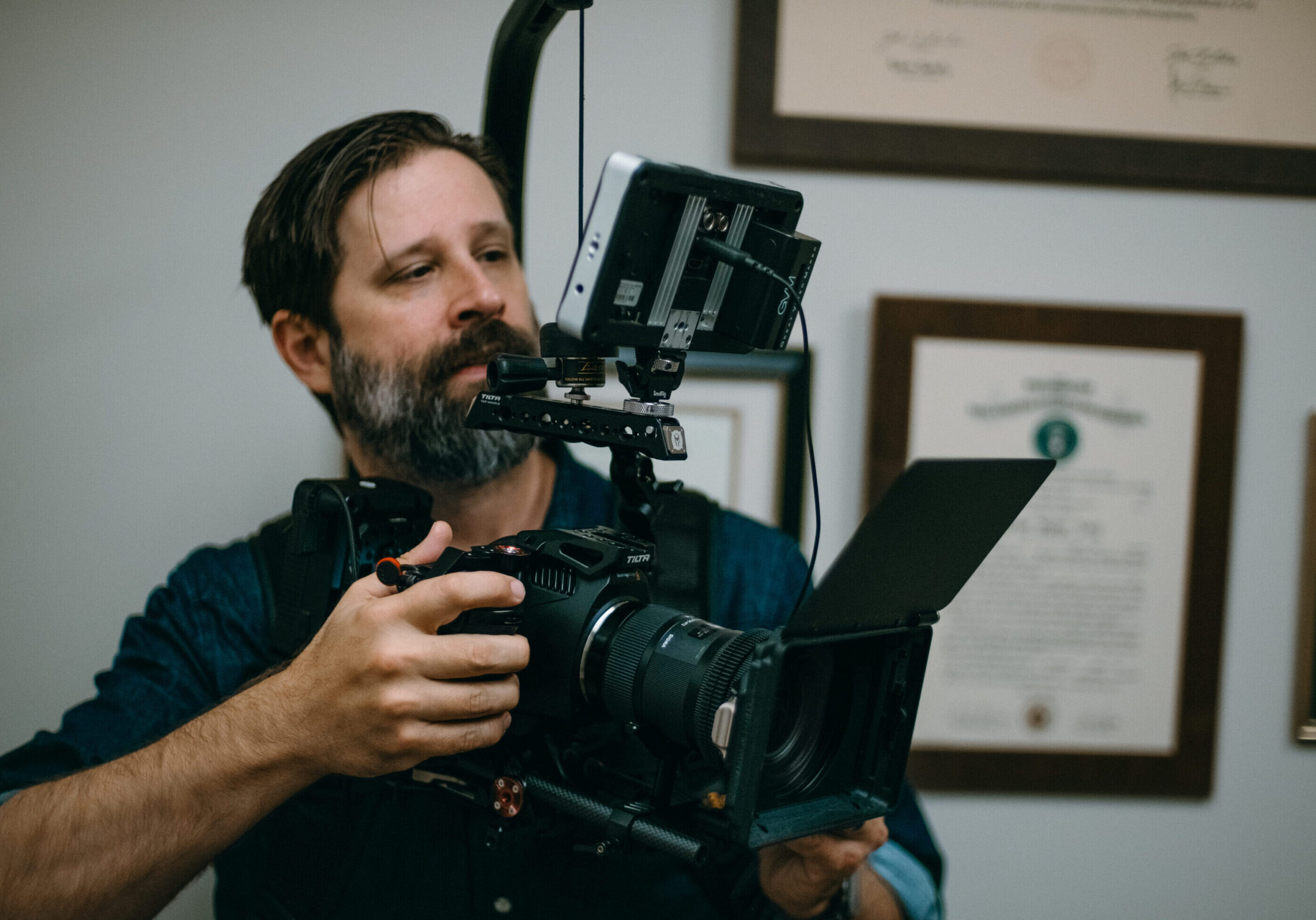 A man holding a camera and taking a picture.